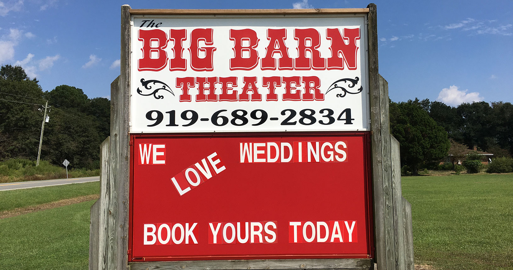 A sign for the big barn theater.